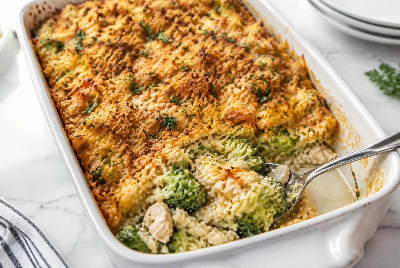 Cheesy Chicken and Broccoli Rice Casserole served in a shallow ceramic bowl