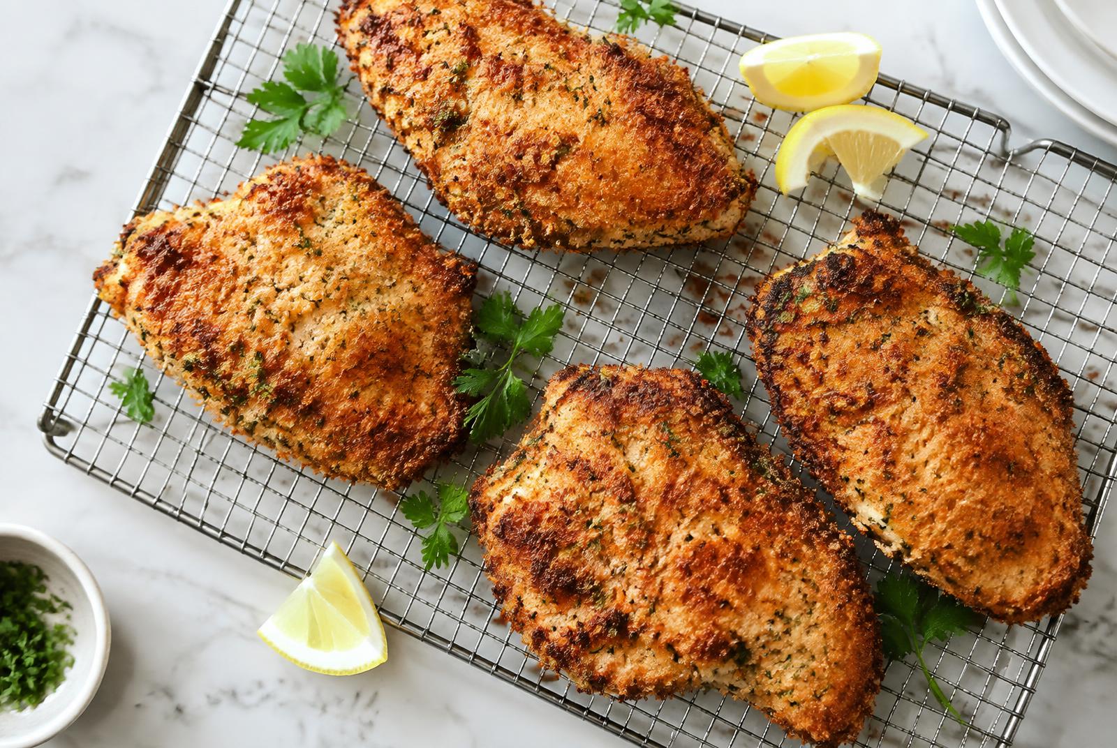 Crispy Parmesan Chicken Cutlets served in a shallow ceramic bowl